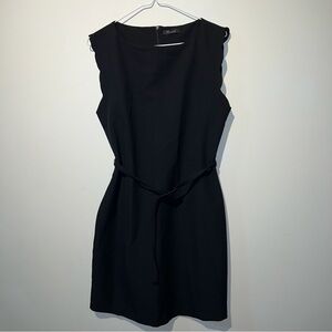 Sleeveless black dress with a belt